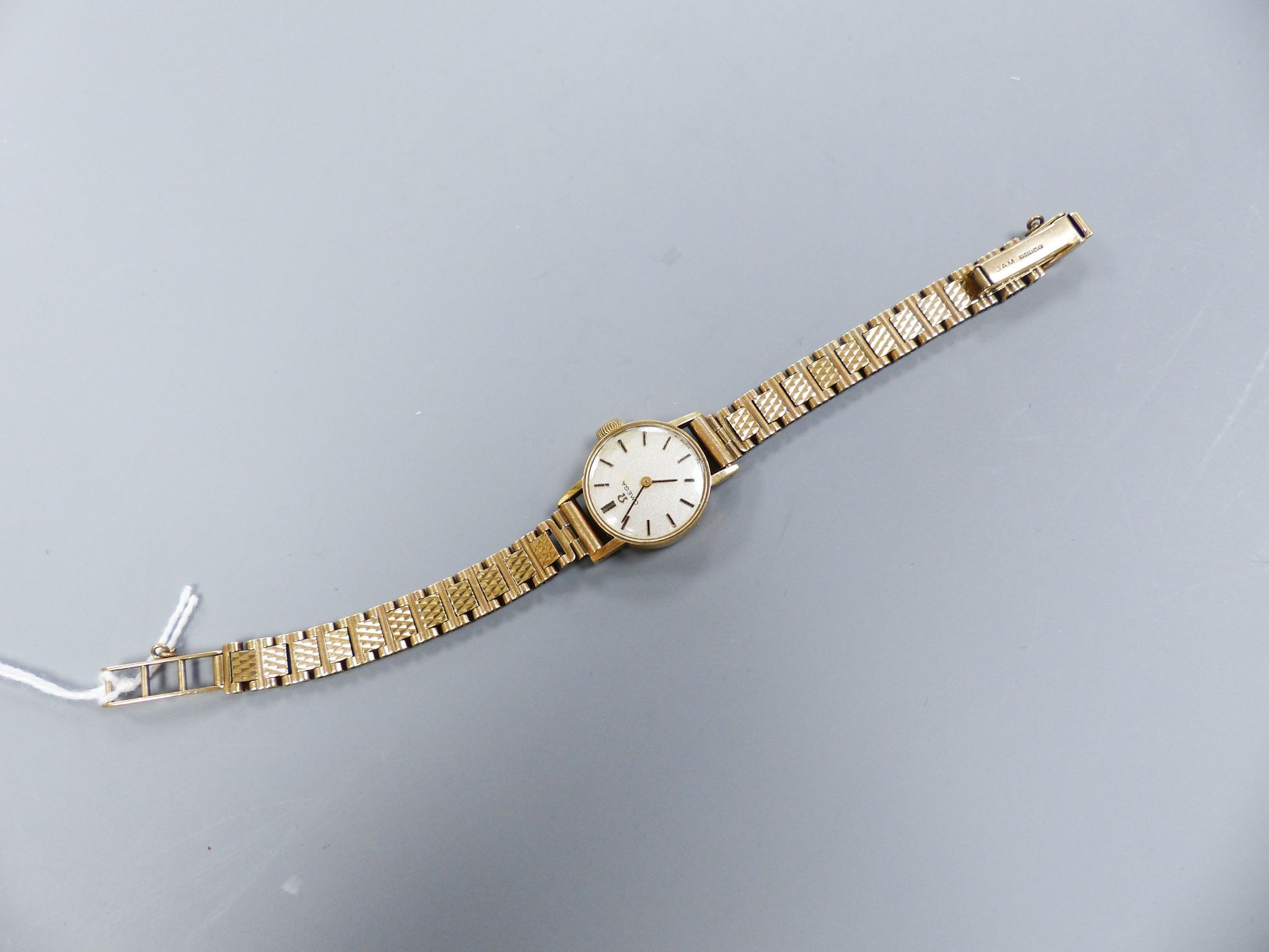 A ladys' Omega 9ct gold manual wind wristwatch, overall length 15.2cm, gross weight 15 grams, with Omega box.